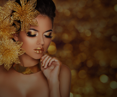 beautiful latina woman with gold makeup